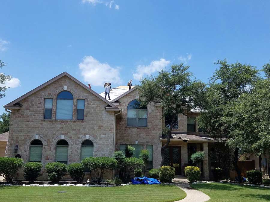 Professionals working on roof